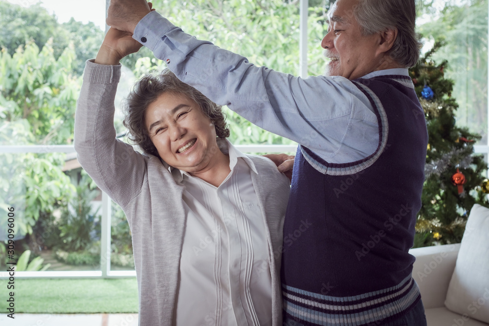 Happy couple old elderly senior man and woman dancing and happy with smiling together at home, retirement and healthcare lifestyle and lover relationship concept Happy couple old elderly senior man and woman dancing and happy with smiling together at home, retirement and healthcare lifestyle and lover relationship concept