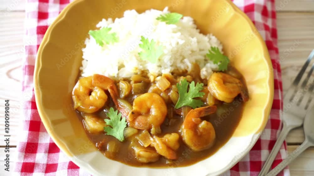 Shrimps in curry sauce on topped rice Shrimps in curry sauce on topped rice