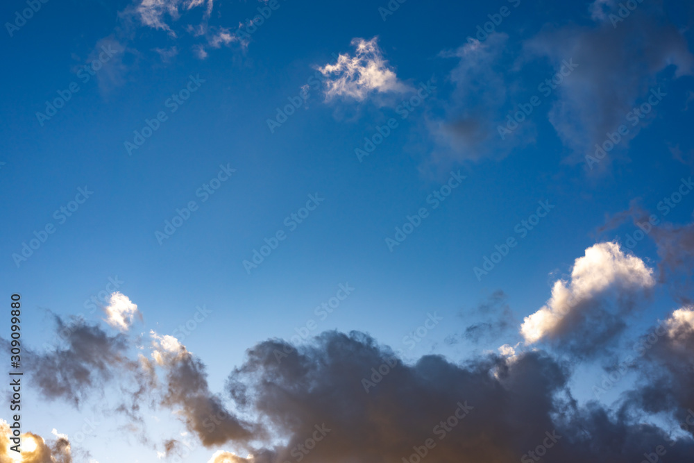 Evening sky with black clouds. Evening sky with white clouds.