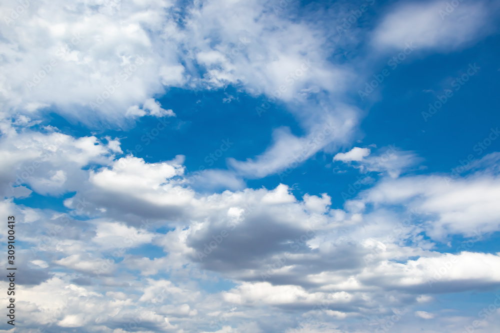 Obraz premium Blue sky background with white clouds.