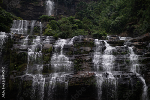 The waterfall in the tropical rain forest, The waterfall and forest, Waterfall and trees in the Bolaven Plateau in southern Laos