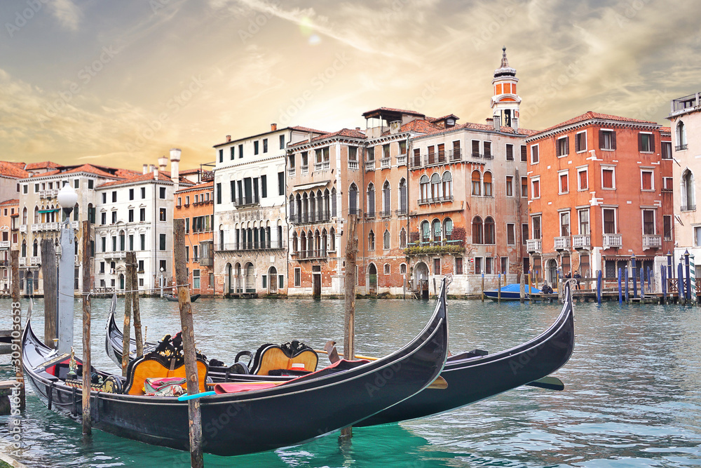 Beautiful view of traditional Gondolas boat on Canal Grande on sunset in Venice, Italy.Travel Vacation Holiday Concept.          