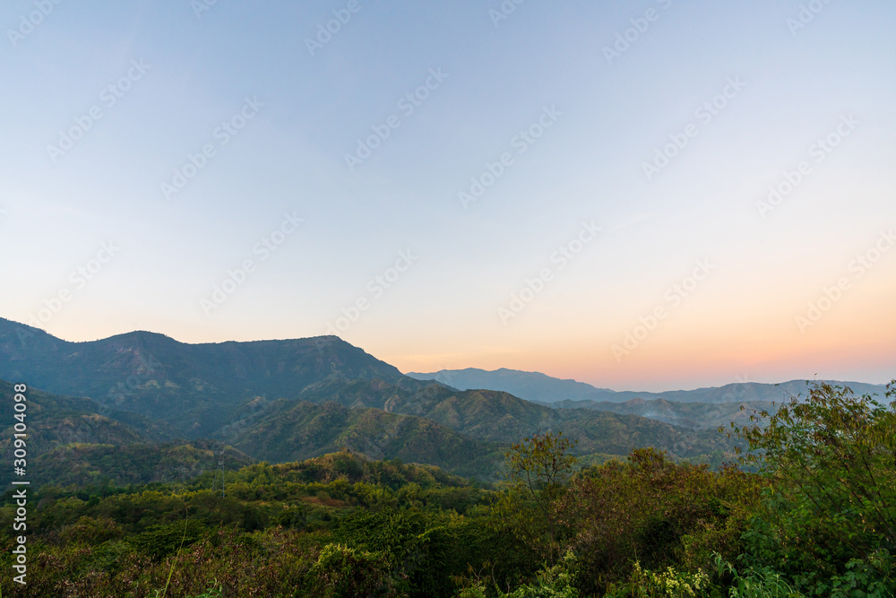 beautiful blue sky high peak mountains mist fog wildlife green forest at Khao Koh Phu Tub Berk Phetchabun Thailand guiding idea long weekend for backpacker camping hiking  