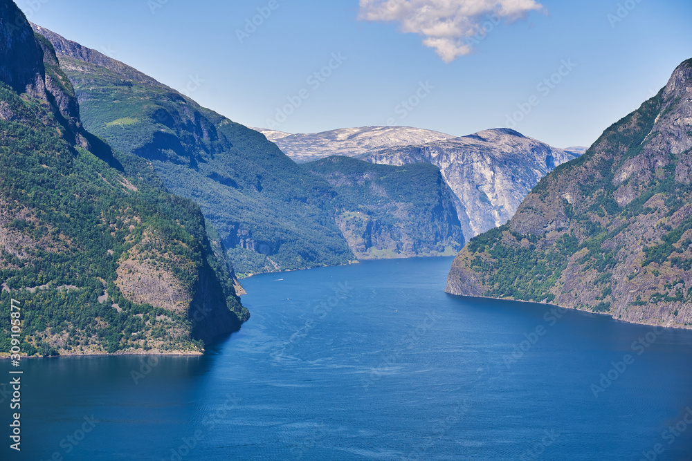 view of the fjord from the top of the mountains, a winding sea path between high Norwegian cliffs