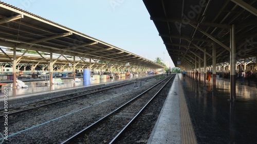 The central Krungthep Hua Lamphong railway station with people on platforms at BANGKOK, THAILAND photo
