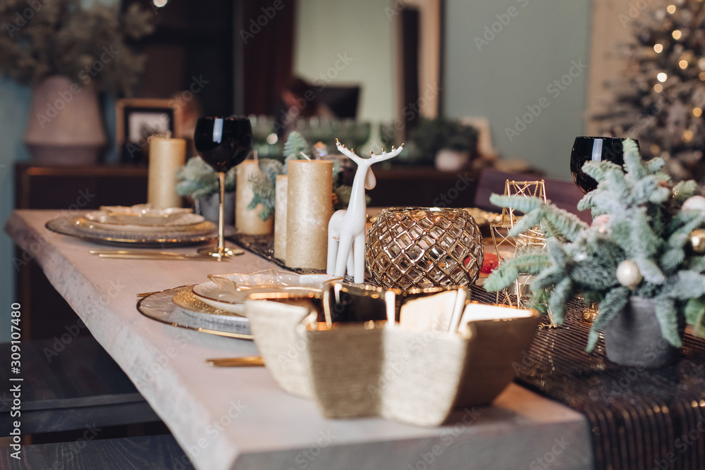 Table served for Christmas dinner in living room. New Year eve concept