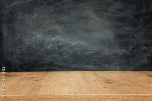 Education image – empty table and blackboard photo