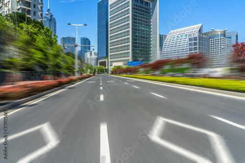 city road through modern buildings in suzhou