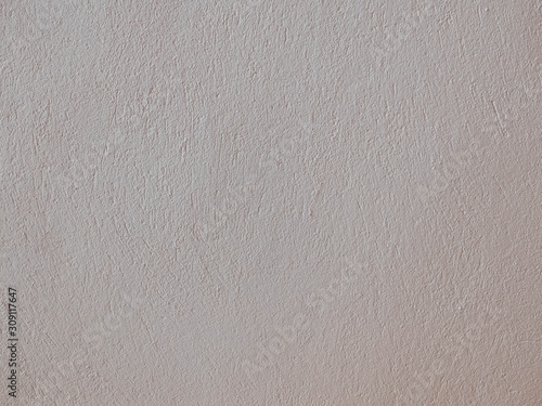 Textured grinded plaster in light beige. Background or texture seamless pattern