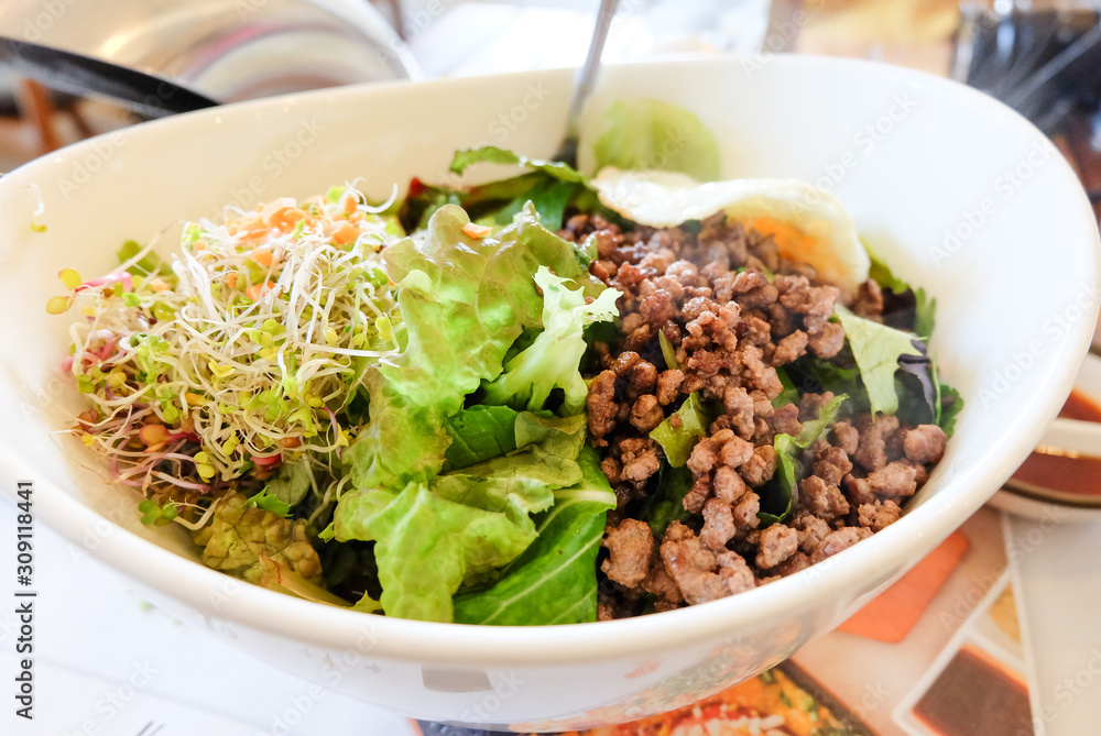 Bibimbap in a bowl, korean dish Bibimbap in a bowl, korean dish
