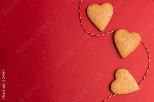 red background with heart cookie, valentines day