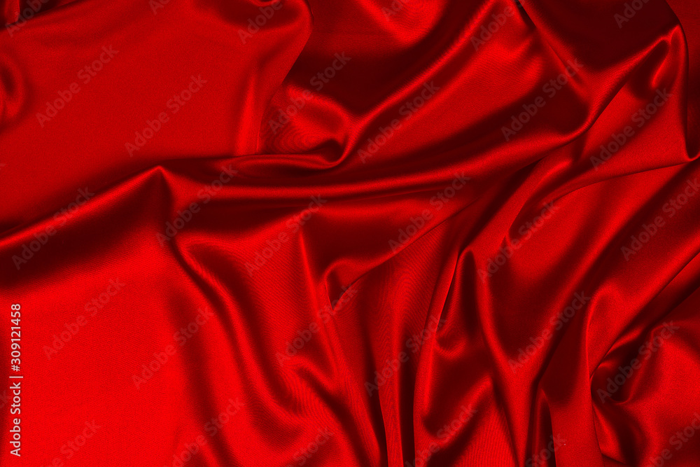 Red silk or satin luxury fabric texture can use as abstract background. Top view. Red silk or satin luxury fabric texture can use as abstract background. Top view.