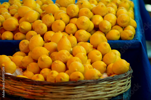 Lemons in the baskets on display at farmer s market