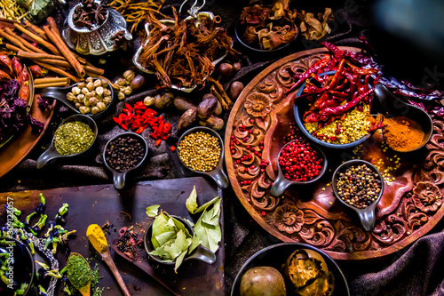 Top view Thai spices and herbs ingredient decoration on wood table for cook in home kitchen. 