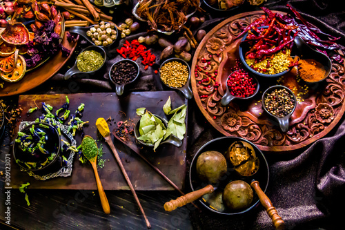 Top view Thai spices and herbs ingredient decoration on wood table for cook in home kitchen. 