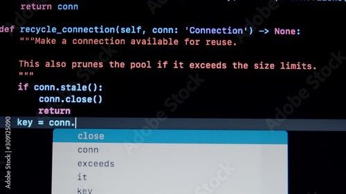 Developer type Python py programming code on laptop screen