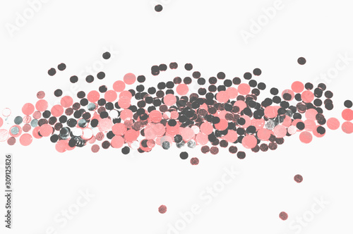 Blurry background with pink glitter on light gray background  shiny confetti in vintage colors