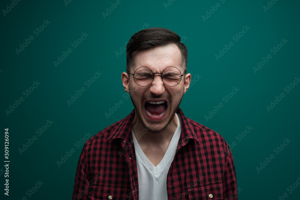 Fototapeta premium Screaming emotional young desperate man