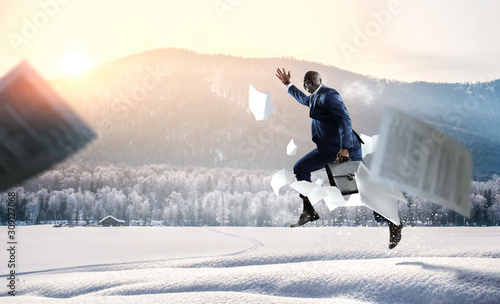 Businessman running in a hurry. Mixed media