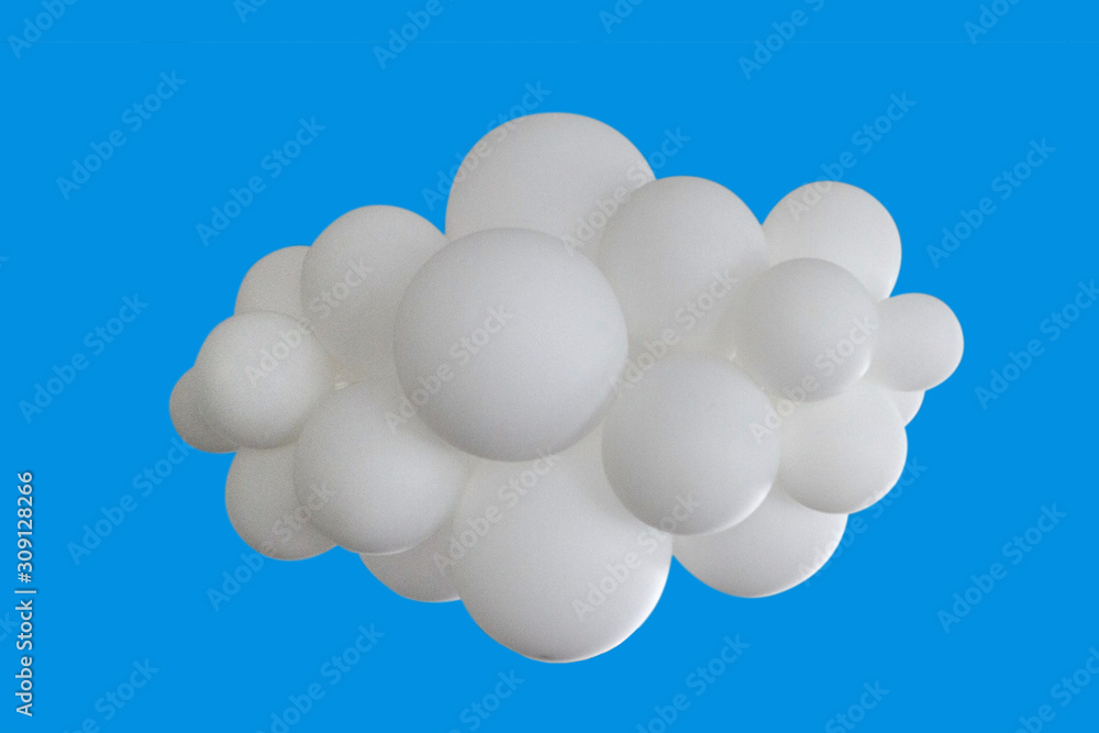 White balloons in the shape of clouds associated on a blue background White balloons in the shape of clouds associated on a blue background