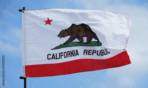State flag of United States of America California fluttering in the wind of the blue sky which it was fine