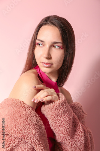 Fashionable young woman on ...