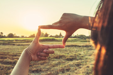 close up woman make hand framing gesture distant view. business concept
