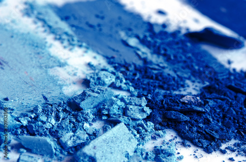 Eyeshadow cosmetic powder scattered. Color of the year 2020 Classic Blue. Copy Space. - Image