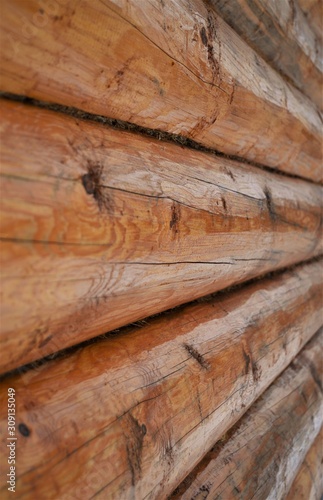 Wooden logs of natural color. Background and texture.