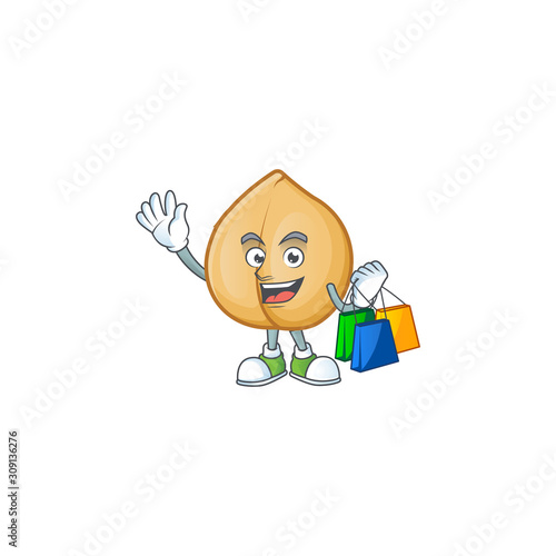 Cheerful chickpeas cartoon character waving and holding Shopping bags