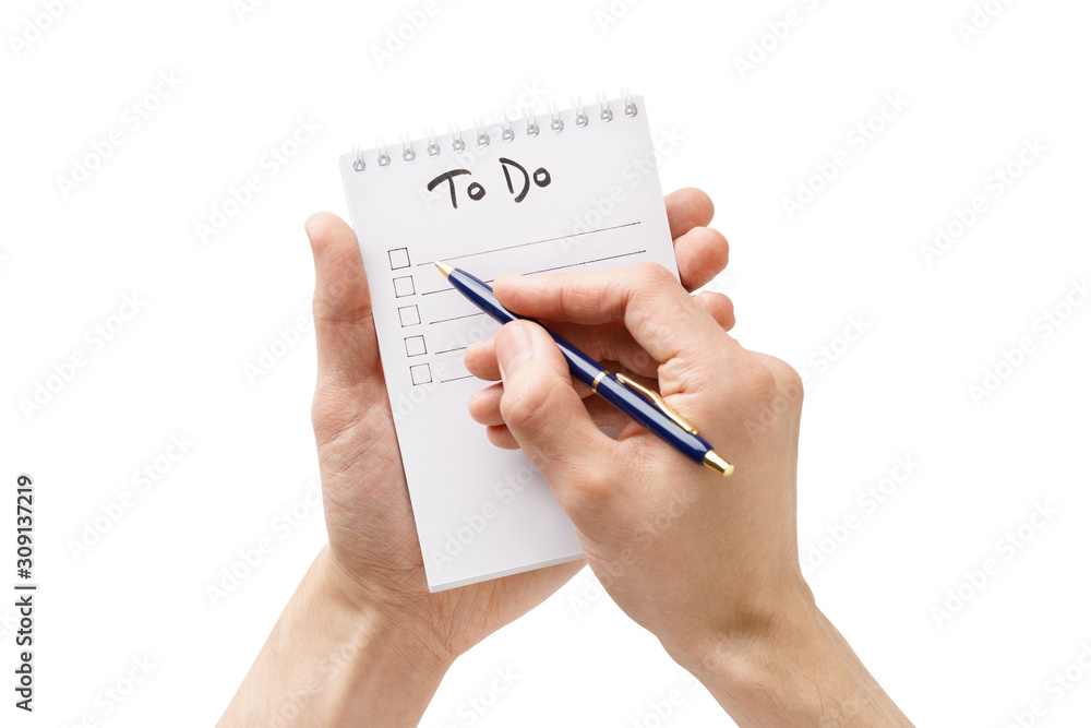 Man hands making a to-do list in a notebook. Isolated. - obrazy, fototapety, plakaty 
