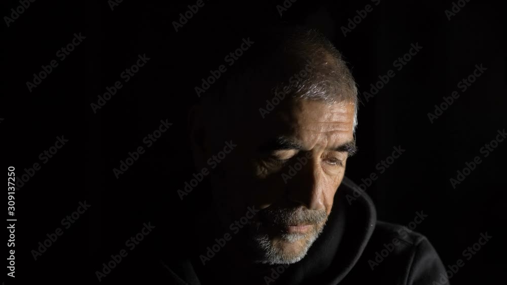 thoughtful depressed mature man looking down, then lifting his glaze on high thoughtful depressed mature man looking down, then lifting his glaze on high