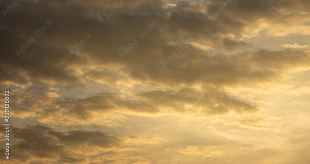 Scenic view of clouds glowing with orange colour during sunset