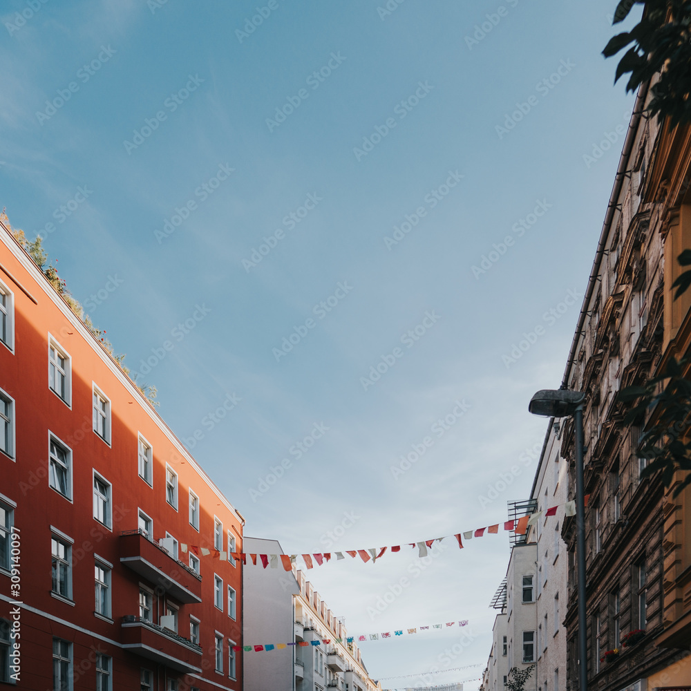 Fototapeta premium Flag decoration hanging between buildings in Berlin 