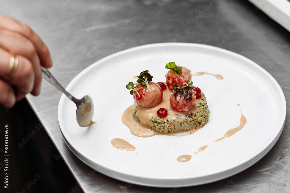 the chef is preparing a presentation of the dish the chef is preparing a presentation of the dish