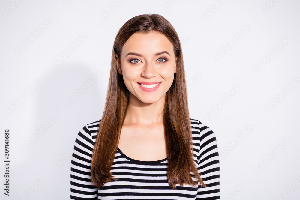 Portrait of charming lady looking at camera wearing striped shirt isolated over white background Portrait of charming lady looking at camera wearing striped shirt isolated over white background