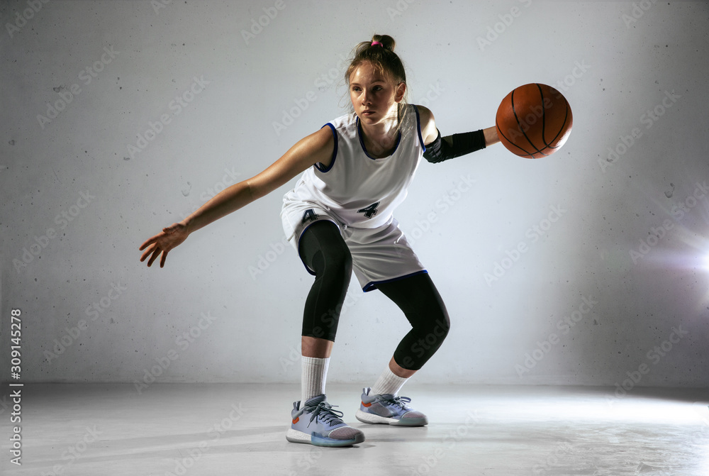 © master1305 - Young caucasian female basketball player of team in action, motion in run isolated on white wall background. Concept of sport, movement, energy and dynamic, healthy lifestyle. Training, practicing. © master1305 - Young caucasian female basketball player of team in action, motion in run isolated on white wall background. Concept of sport, movement, energy and dynamic, healthy lifestyle. Training, practicing.