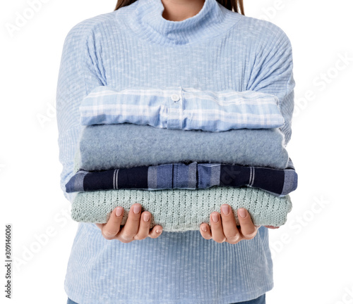 Young woman with clean clothes on white background, closeup