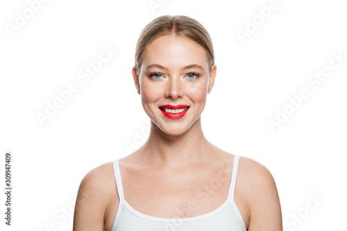 Smiling woman with healthy clear skin isolated on white background