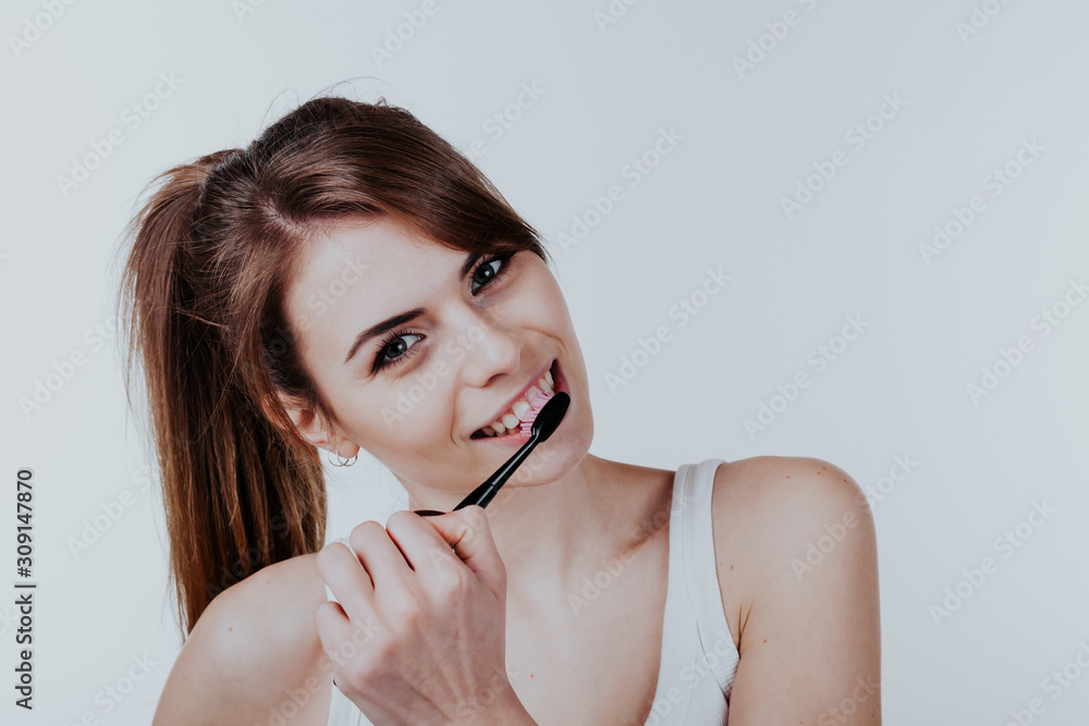 pretty girl in the bathroom brushing his teeth smile pretty girl in the bathroom brushing his teeth smile
