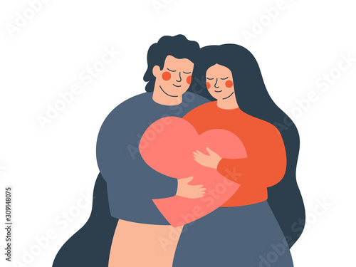 A young couple embraces each other with love and care. Happy woman and man hold a big heart together. Concept of the Valentine day and family day