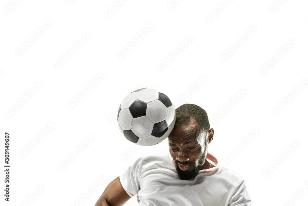 Close up of emotional african man playing soccer hitting the ball with the head on isolated white background. Football, sport, facial expression, human emotions, healthy lifestyle concept. Copyspace. Close up of emotional african man playing soccer hitting the ball with the head on isolated white background. Football, sport, facial expression, human emotions, healthy lifestyle concept. Copyspace.
