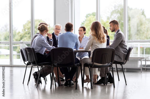 business  people and corporate concept - business team meeting at office