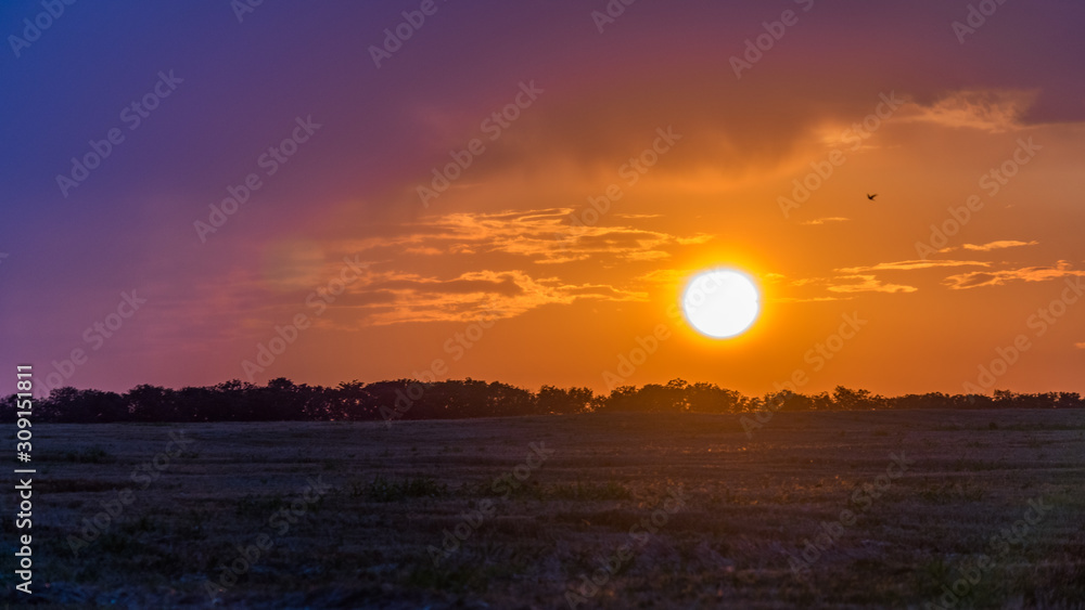 Beautiful Sunrise over the field.Summer evening in Blagoveshenskaya. Anapa, Russia. Beautiful Sunrise over the field.Summer evening in Blagoveshenskaya. Anapa, Russia.