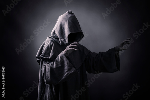 Scary figure in hooded cloak