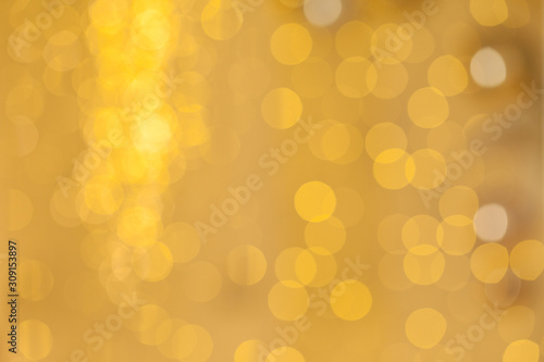 Golden surface of the glittering sheet reflects light background