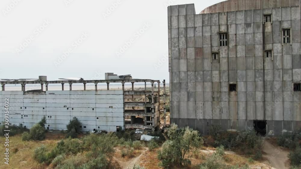 Main building view Giant construction in the middle of the field AERIAL SHOT CRIMEA near SHELKINO city AUGUST 2019 Old abandoned atomic power station from soviet union times Main building view Giant construction in the middle of the field AERIAL SHOT CRIMEA near SHELKINO city AUGUST 2019 Old abandoned atomic power station from soviet union times