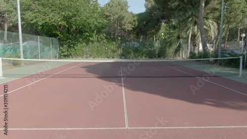 Wallpaper Mural Aerial flight over an empty outdoor tennis carpet court ready for a match Torontodigital.ca
