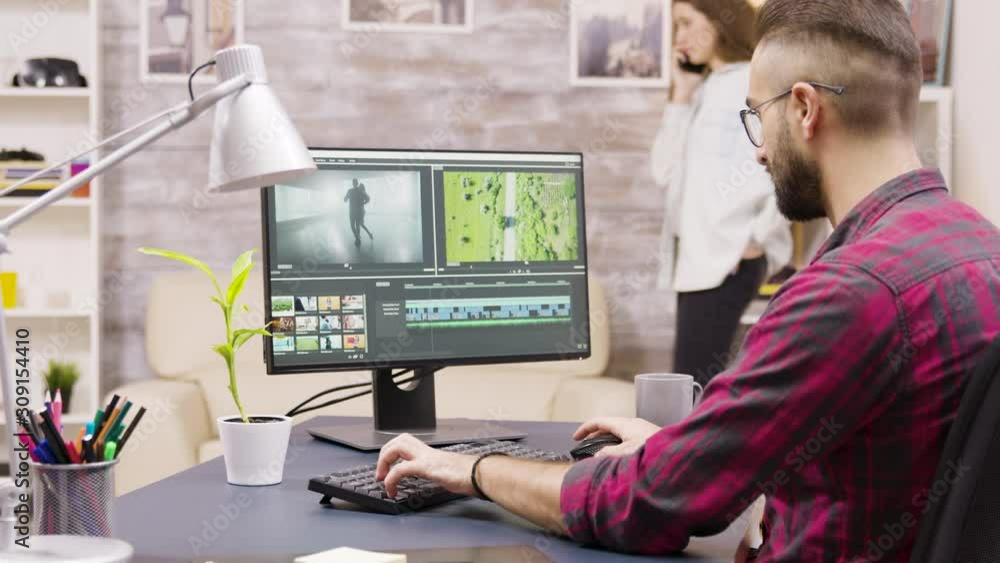 Creative filmmaker working on post production of a movie Creative filmmaker working on post production of a movie