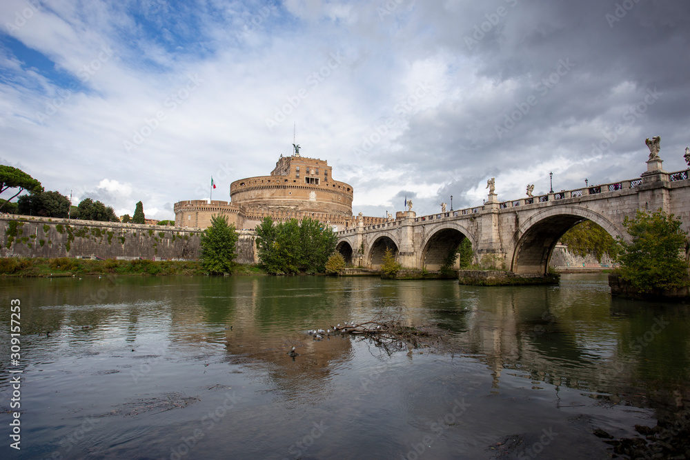 View of the Tiber river and the castle of St Angelo in the background